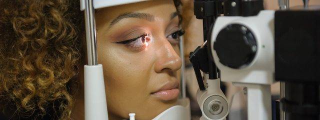 Optometrist, woman getting eyes checked in Fort Lauderdale, FL